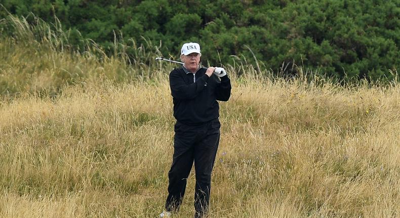 Former President Donald Trump plays a round of golf at Trump Turnberry Luxury Collection Resort during his first official visit to the United Kingdom on July 15, 2018, in Turnberry, Scotland.
