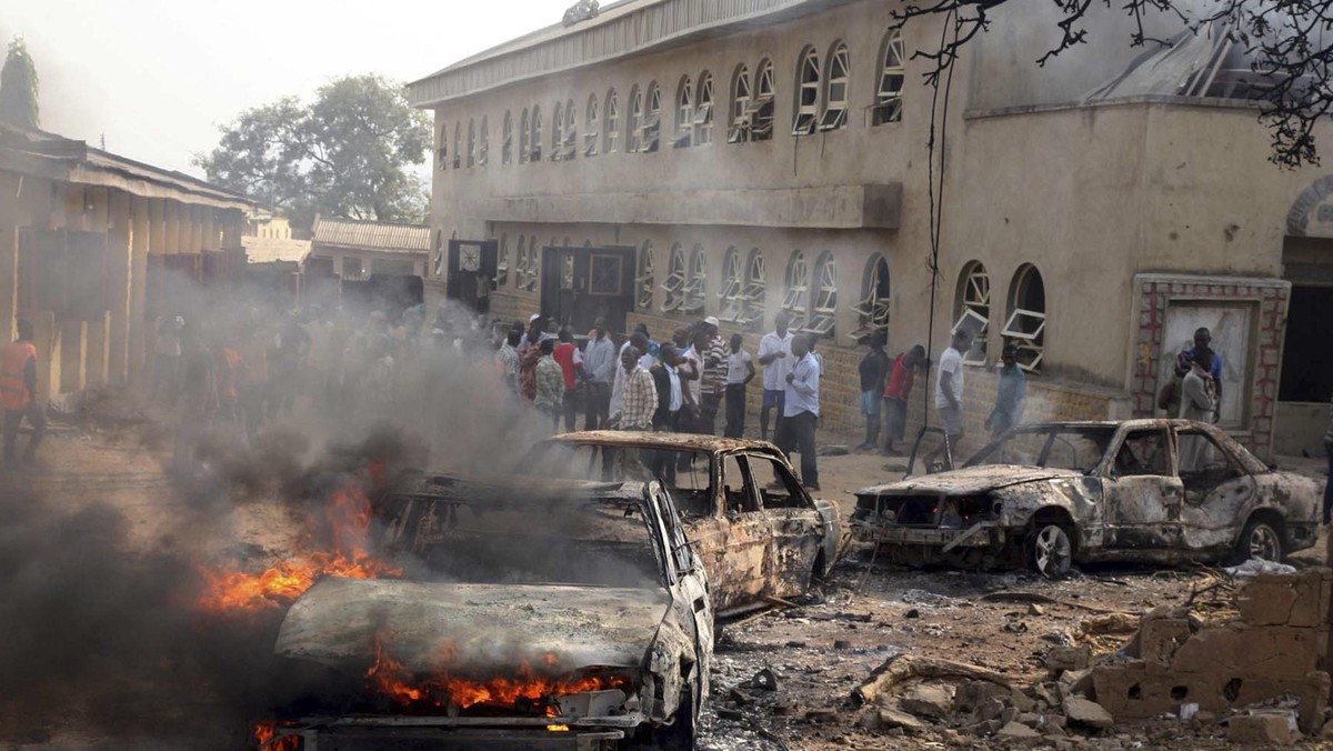 File photo shows a car burning at the scene of a Boko Haram bomb explosion at St. Theresa Catholic C