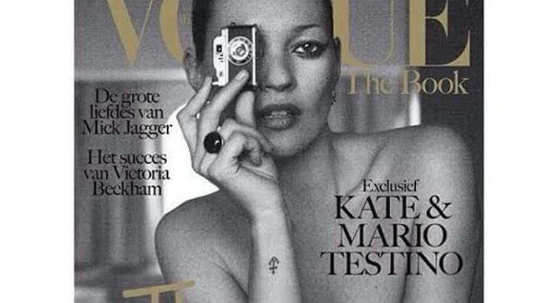 Kate Moss poses topless for Vogue