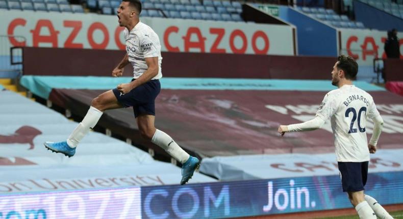 Manchester City midfielder Rodri celebrates scoring at Aston Villa Creator: CARL RECINE