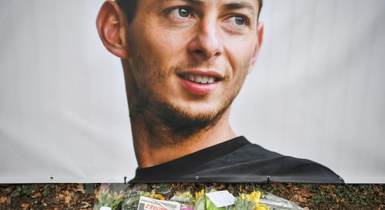 Tributes are left in front of a portrait of Emiliano Sala at the entrance of the FC Nantes football club training center La Joneliere in La Chapelle-sur-Erdre, two days after his plane vanished mid-flight