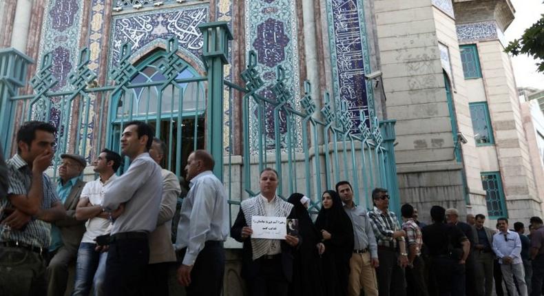 Iranians queue to vote in an election seen as a verdict on the rule of President Hassan Rouhan