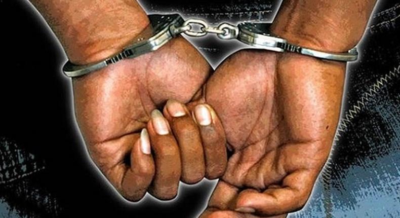 Hand with handcuff (Stock photo)