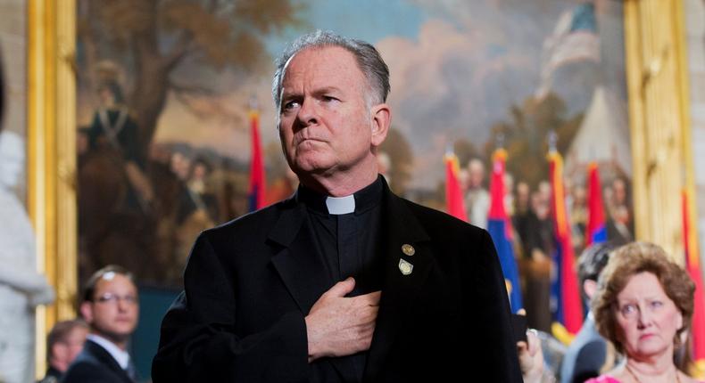 UNITED STATES - APRIL 11: Rev. Patrick Conroy, Chaplain of the House, attends the 2013 National Days of Remembrance ceremony in the Capitol rotunda to honor the victims of the Holocaust. (Photo By Tom Williams/CQ Roll Call)