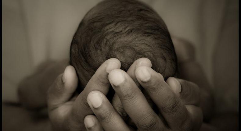 A person holding a baby