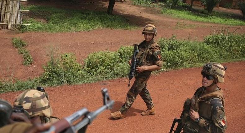 French soldiers walk towards Seleka fighters in Bambari May 31, 2014. Picture taken May 31, 2014. REUTERS/Goran Tomasevic