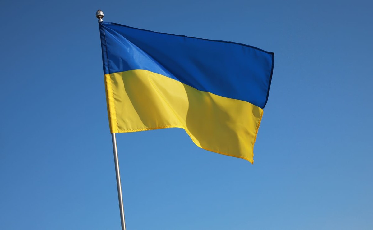 National,Flag,Of,Ukraine,Against,Blue,Sky