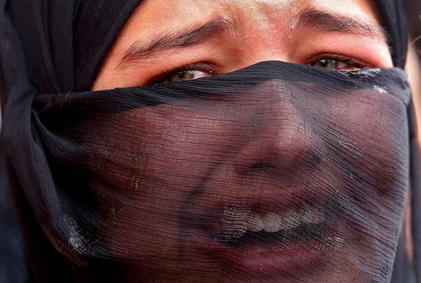 Girl mourns during the funeral of Aaquib Gul in Srinagar