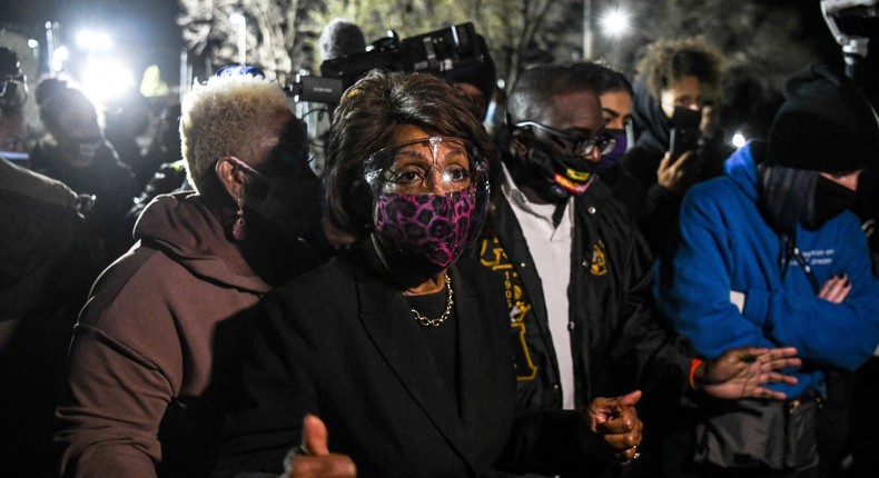 Representative Maxine Waters(C) (D-CA) speaks to the media during an ongoing protest at the Brooklyn Center Police Department in Brooklyn Centre, Minnesota on April 17, 2021. - Police officer, Kim Potter, who shot dead Black 20-year-old Daunte Wright in a Minneapolis suburb after appearing to mistake her gun for her Taser was arrested April 14 on manslaughter charges.
