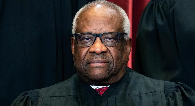 Justice Clarence Thomas sits during a group photo at the Supreme Court in Washington, on Friday, April 23, 2021.