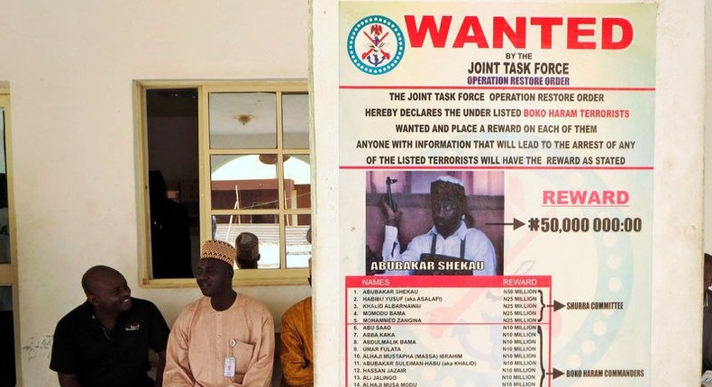 FILE PHOTO - A poster advertising for the search of Boko Haram leader Abubakar Shekau is pasted on a wall in Baga village on the outskirts of Maiduguri, in the north-eastern state of Borno, Nigeria May 13, 2013. 