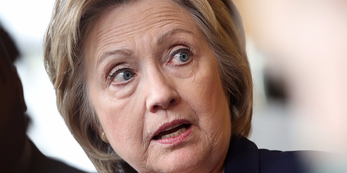 Democratic presidential candidate and former US Secretary of State Hillary Clinton speaks with voters at the Mug and Muffin Cafe on May 9, 2016 in Stone Ridge, Virginia.