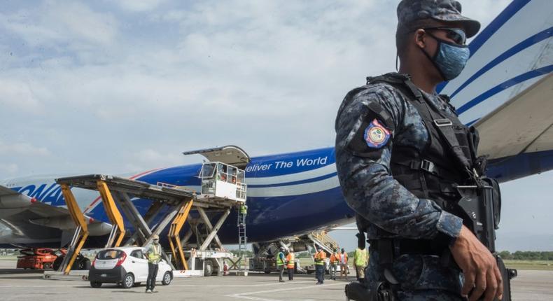 Chinese aid is unloaded from a plane in Haiti, one of many shipments of medical supplies by Beijing to combat the coronavirus