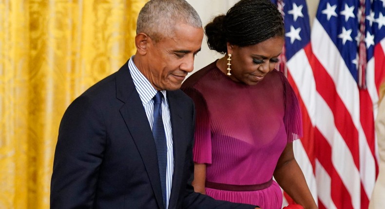 Former President Barack Obama holds hands with former first lady Michelle Obama in September 2022.Andrew Harnik/AP Photo