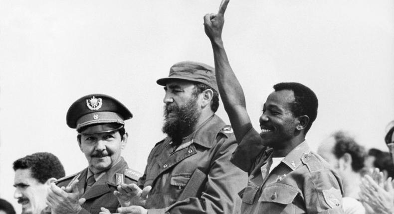 Then Ethiopian President Lieutenant Colonel Mengistu Haile Mariam (R) makes V sign alongside Fidel Castro (C) and Raul Castro (L) during an official visit to Havana, Cuba, on April 15, 1975
