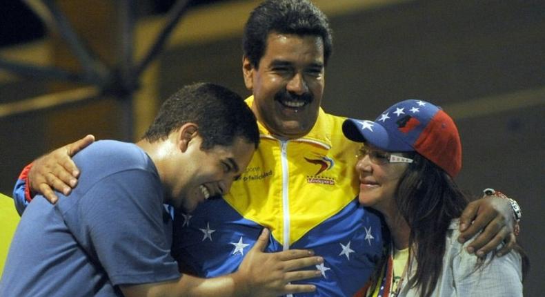 Venezuelan President Nicolas Maduro's son, Nicolas Ernesto Maduro, left, is joining his father's disputed assembly to rewrite the constitution