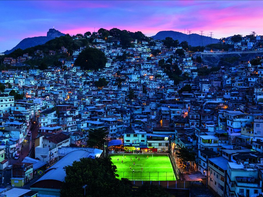 Kemball-Cook came up with the idea to install tiles under a football pitch in a favela in Brazil after becoming "Shell Entrepreneur of the Year." The idea was to "go to a favela that has big energy issues" and "inspire the next generation through power."