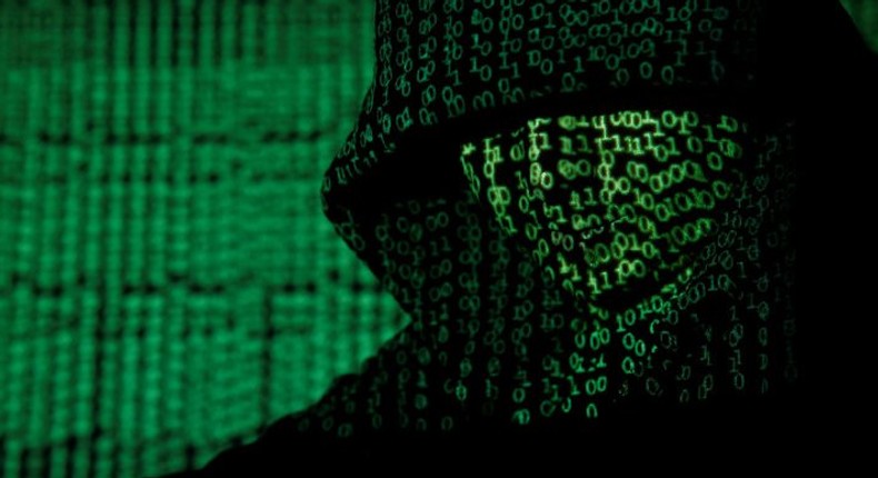 A projection of cyber code on a hooded man is pictured in this illustration picture taken on May 13,  2017. Capitalizing on spying tools believed to have been developed by the U.S. National Security Agency, hackers staged a cyber assault with a self-spreading malware that has infected tens of thousands of computers in nearly 100 countries. REUTERS/Kacper Pempel/Illustration     TPX IMAGES OF THE DAY