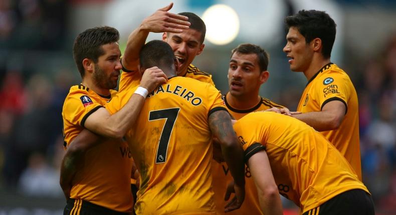 Ivan the great: Wolves midfielder Ivan Cavaleiro (2nd L) is mobbed by his team-mates after scoring the only goal of a 1-0 win away to Bristol City in the FA Cup fifth round