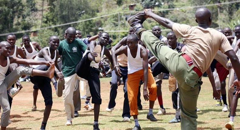 Prospective police recruits are guided during a physical exercise session at Kabarnet Stadium in Baringo Central on April 20, 2015.