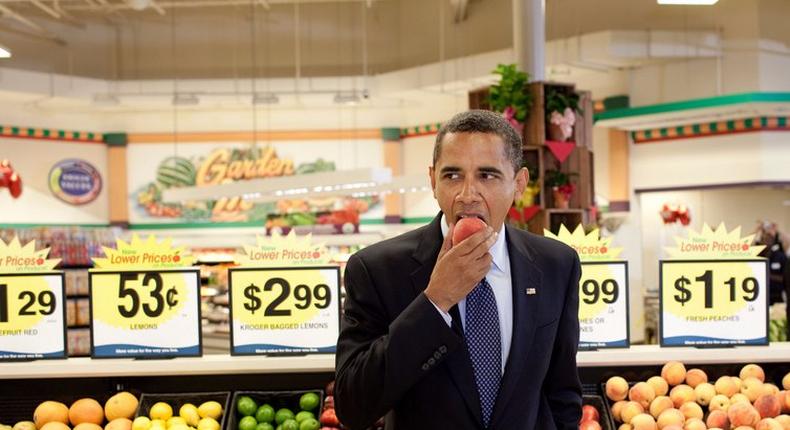 President Barack Obama eats a peach following a town hall meeting at Kroger's Supermarket in Bristol, Va. on July 29, 2009.