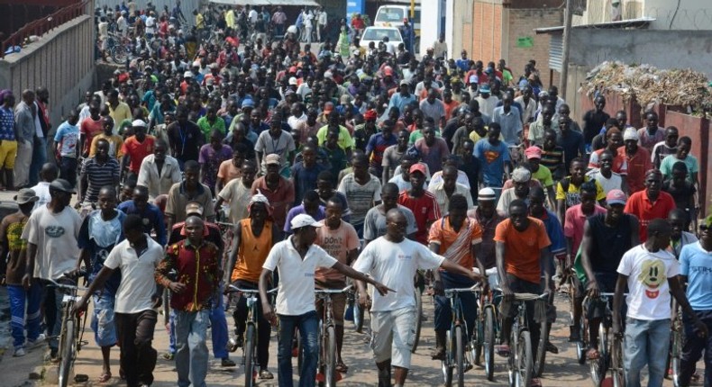 People demonstrate outside the office of the United Nations Human Rights Commissioner in Bujumbura in Burundi