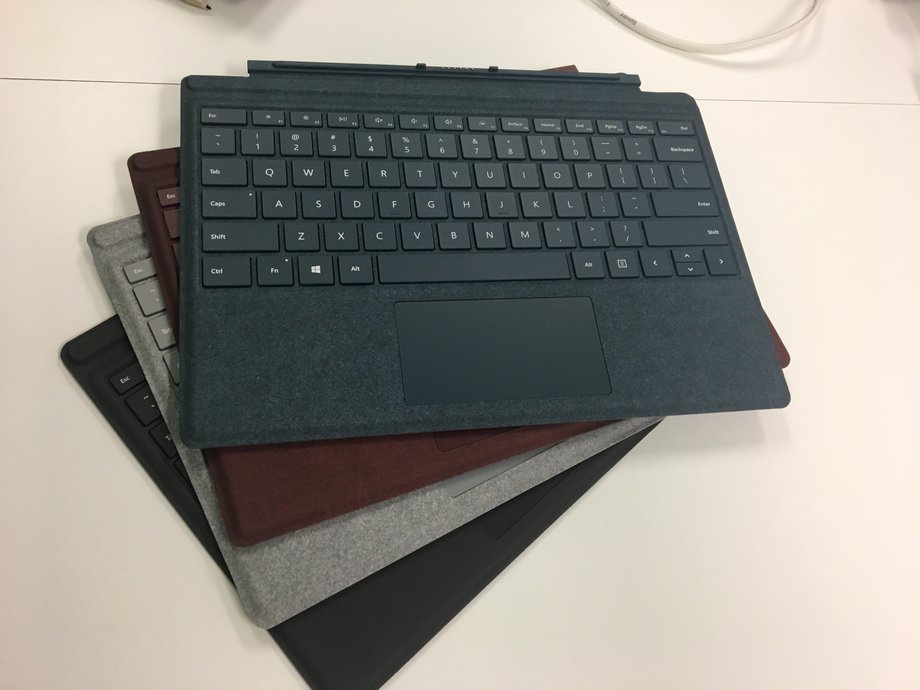 The new colors of Surface Pro Signature Type Cover. These high-end models are covered in alcantara fabric and go for $159 a pop — but they turn the Surface Pro into a proper laptop.