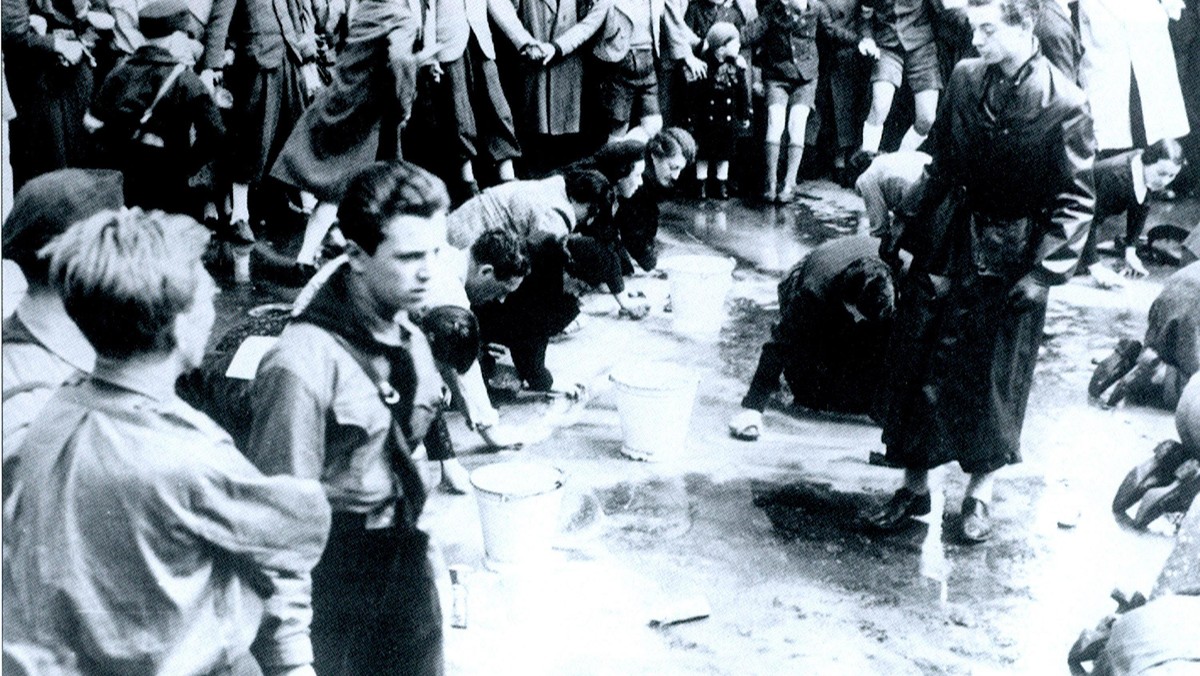 Austrian Jews forced to wash a street in Vienna following the German Anschluss (Annexation) of Austr