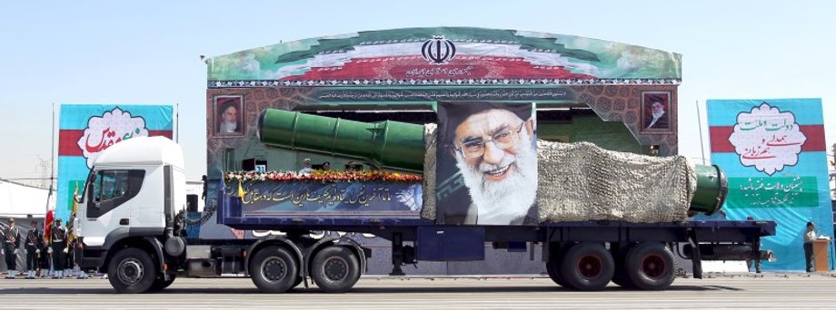 A military truck carrying a missile and a picture of Iran's Supreme Leader Ayatollah Ali Khamenei during a parade marking the anniversary of the Iran-Iraq war (1980-88), in Tehran.