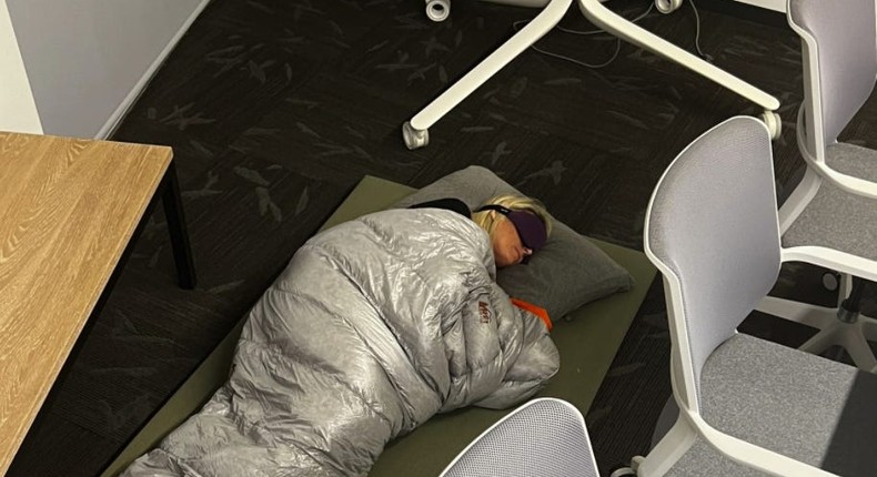 An employee posted a picture on Twitter of Esther Crawford sleeping in the office.Twitter