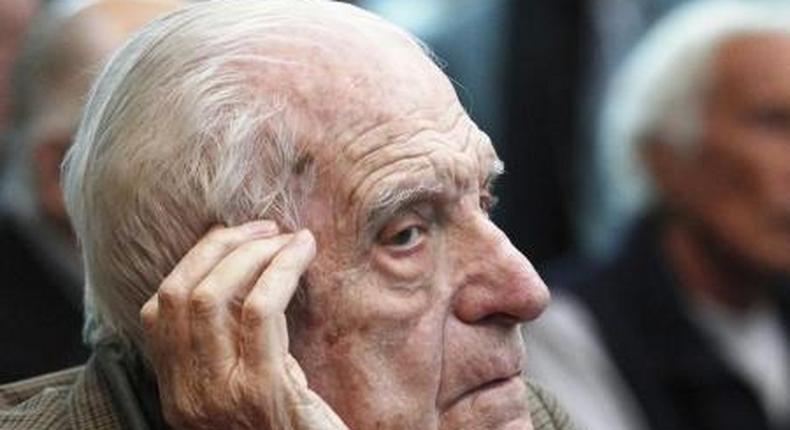 Argentina's former President and Army Chief Reynaldo Bignone sits in a courthouse during the first day of his trial, accused of participating in Operation Condor, in Buenos Aires March 5, 2013.