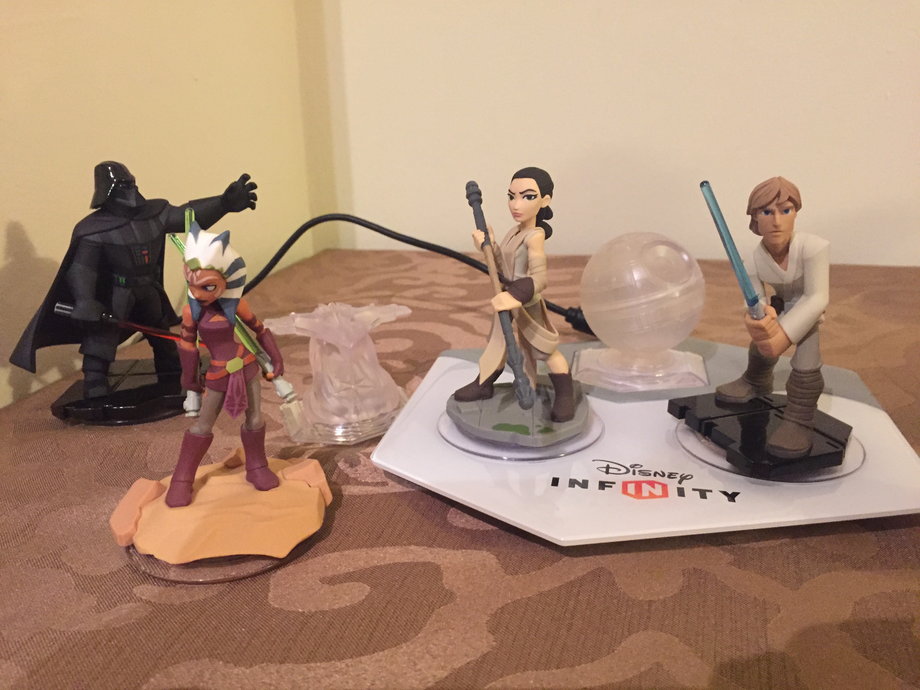 For a more traditional, and very fun, gaming experience, "Disney Infinity" sells playsets that include two characters and a clear plastic piece for the Infinity Base, for around $30. See the tiny Death Star on the base? That unlocks the "Rise Against The Empire" adventure, based on the original "Star Wars" trilogy.
