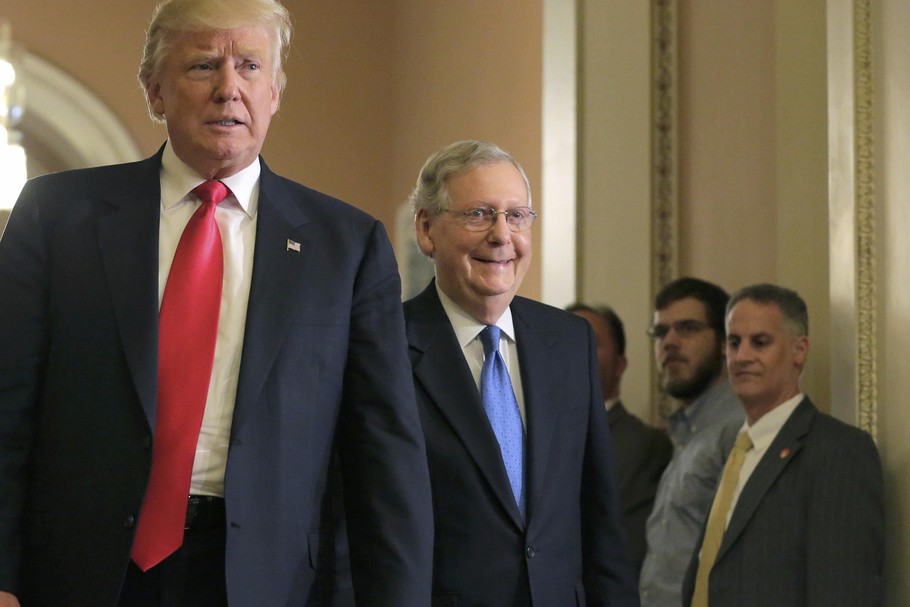 U.S. President-elect Donald Trump walks with Senate Majority Leader McConnell on Capitol Hill in Washington