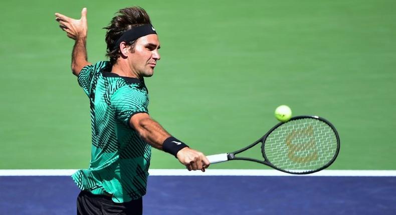 Roger Federer of Switzerland hits a backhand return to Jack Sock of the US in their men's semifinal ATP Indian Wells Masters in Indian Wells, California on March 18, 2017