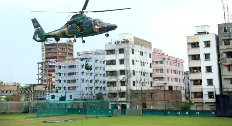 Commandos disembark from a helicopter during a war game at the Sher-e-Bangla National Stadium in Dhaka on October 6, 2016, a day before the first ODI cricket match between Bangladesh and the visiting England team