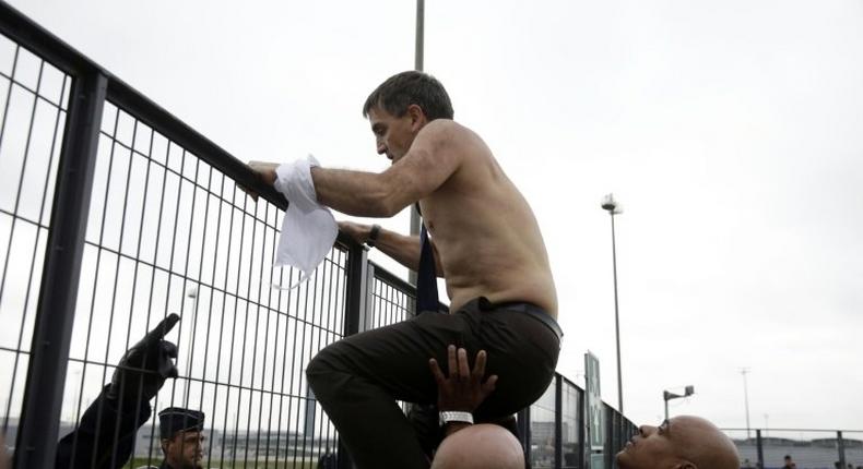 Air France executive Xavier Broseta escapes from angry employees during a 2015 protest in Roissy-en-France