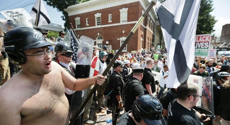 White nationalists, neo-Nazis and members of the 'alt-right' exchange insluts with counter-protesters in Charlottesville, Virginia, on August 12, 2017