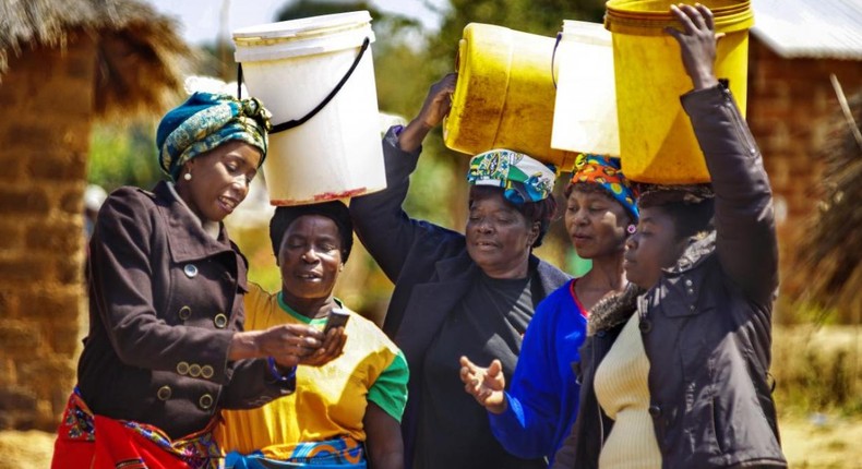 Picture of women with buckets (WHO Africa)