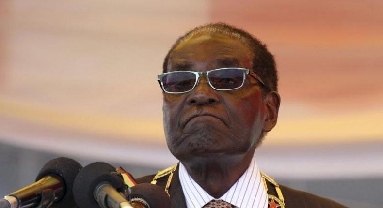 President Robert Mugabe waits to address crowds gathered for Zimbabwe's Heroes Day commemorations  in Harare, August 10, 2015. REUTERS/Philimon Bulawayo