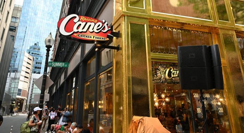 A gold Raising Cane's storefront in BostonDave Kotinsky / Getty Images