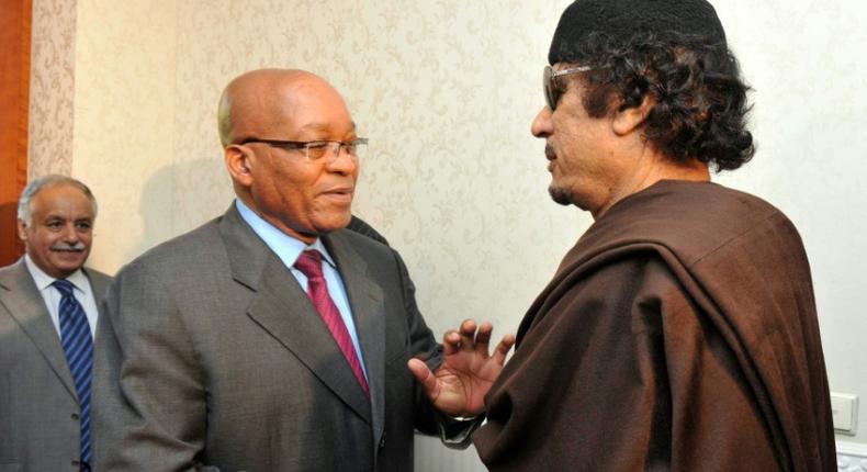 Zuma, left, pictured with Kadhafi on May 30 2011, when he made a one-day visit to Tripoli as head of an African Union delegation mediating in the Libyan crisis. Zuma has denied a newspaper report that he was given $30 million by Kadhafi for 'safe keeping'