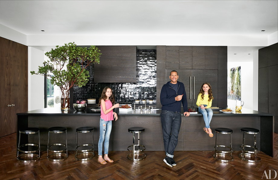 Here's A-Rod in his kitchen with his daughters Natasha and Ella. Industrial materials and textures like steel and concrete are used liberally throughout, and contrast with glossy tile and polished wood.