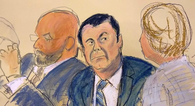 Joaquin El Chapo Guzman, center, sits next to his defense attorney Eduardo Balarezo, left, for opening statements in a courtroom sketch as his trial in the Brooklyn, New York, November 13, 2018.