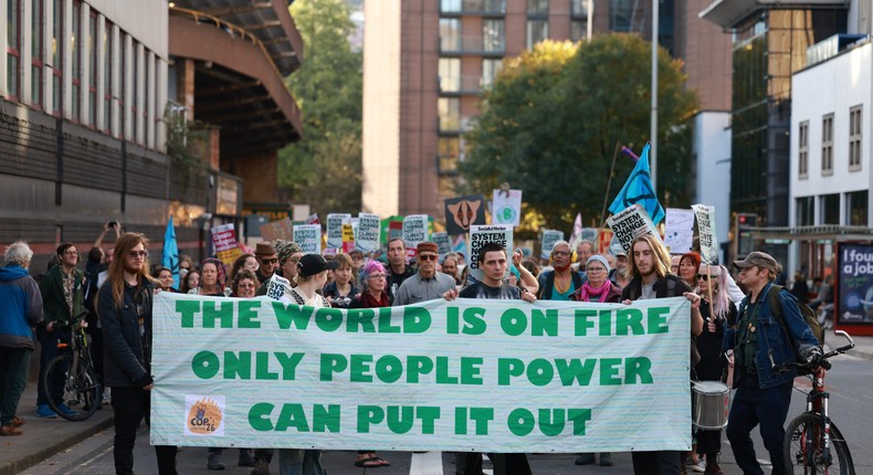 Demonstrators holding a banner and placards march towards the city center during the rally in Bristol, UK on November 12, 2022.SOPA Images / Contributor