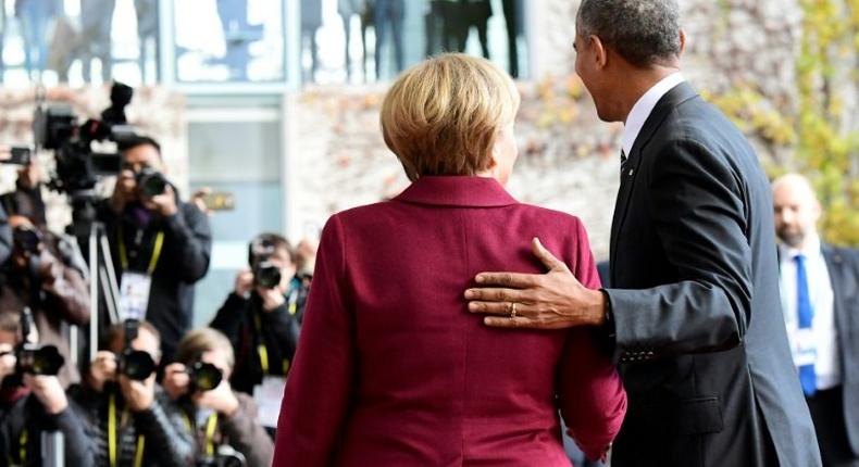 German Chancellor Angela Merkel greets US President Barack Obama in Berlin on November 18, 2016