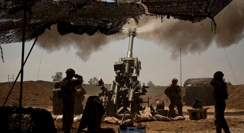 In this file photo, US soldiers from the 82nd Airborne Division fire artillery in support of Iraqi forces fighting Islamic State militants from their base east of Mosul.AP Photo/Maya Alleruzzo