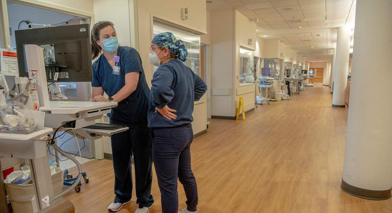 Healthcare workers are seen inside the COVID Intensive Care Unit in North Oaks Hospital in Hammond, Louisiana, on August 13, 2021.
