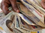 Nigeria’s currency hits a new record low on the official market