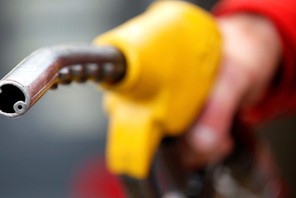 FILE PHOTO: An attendant prepares to refuel a car at a petrol station in Rome