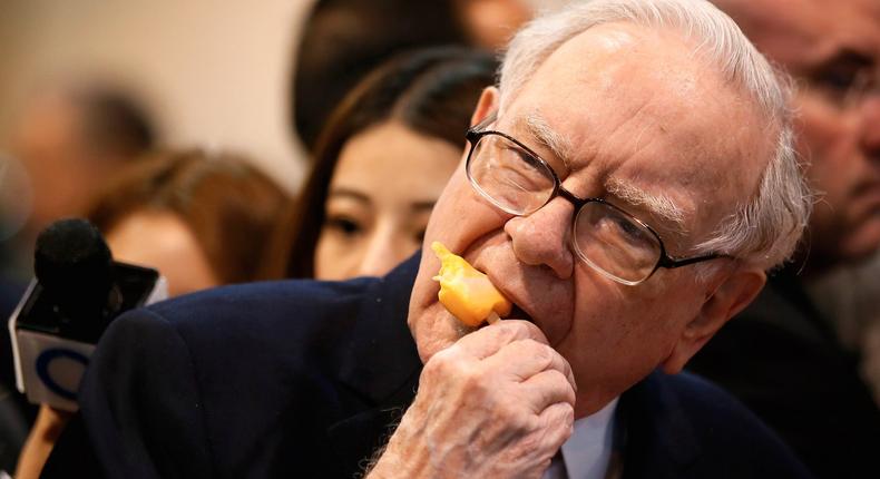 Berkshire Hathaway chairman and CEO Warren Buffett eating a treat from Dairy Queen before the Berkshire Hathaway annual meeting in Omaha, Nebraska.